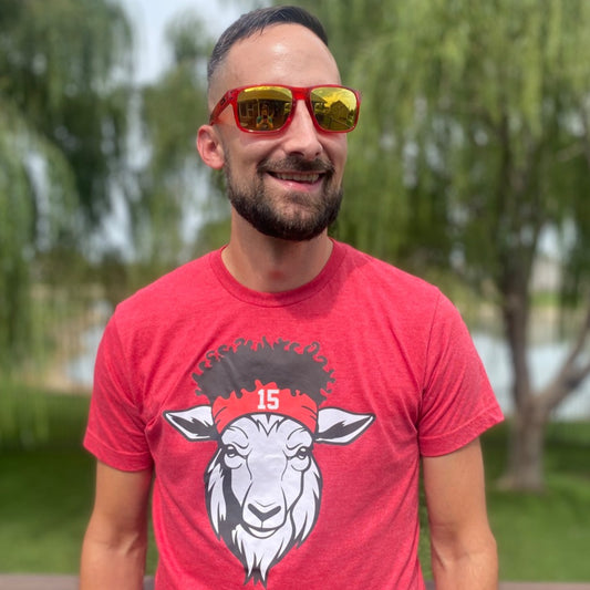 heather red Kansas City Chiefs t-shirt of QB Patick Mahome as goat with head band, frizzy hair, and #15