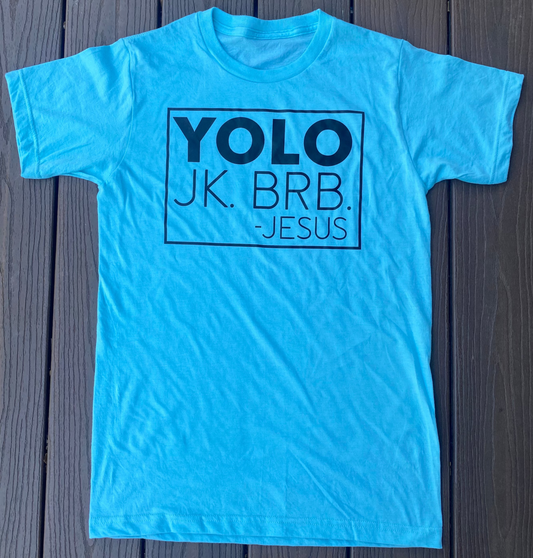Light blue t-shirt with black text on a wooden surface. Funny Christian t-shirt about Jesus coming back to life for Easter.
